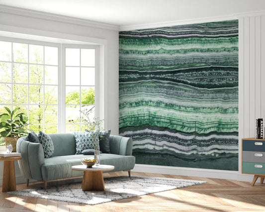 Layered stone wall mural sits behind a low bed in a calm Living room setting.