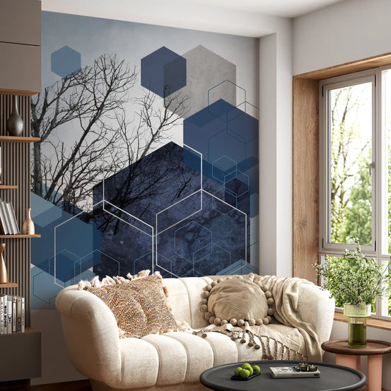 Hexagons and bare branches sit  in a bright living room.
