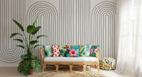 Slim ivory backdrop and dark arches sit in a lounge via the Subtle Arch Rhythm wall mural