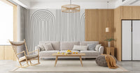 Slim black arches loop upward across pale ivory in the Subtle Arch Rhythm wall mural.