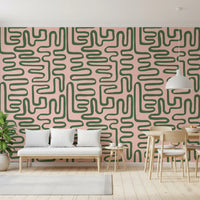 Curved line wall mural with soft blush backing and sage green pattern flow