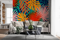 Bold tropical leaf wall mural with bright blue and orange organic shapes