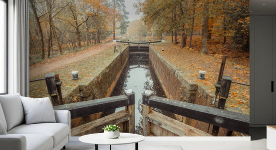 Autumn lake wall mural with amber leaves and reflections