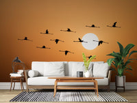 Bird silhouette wall mural with amber horizon background