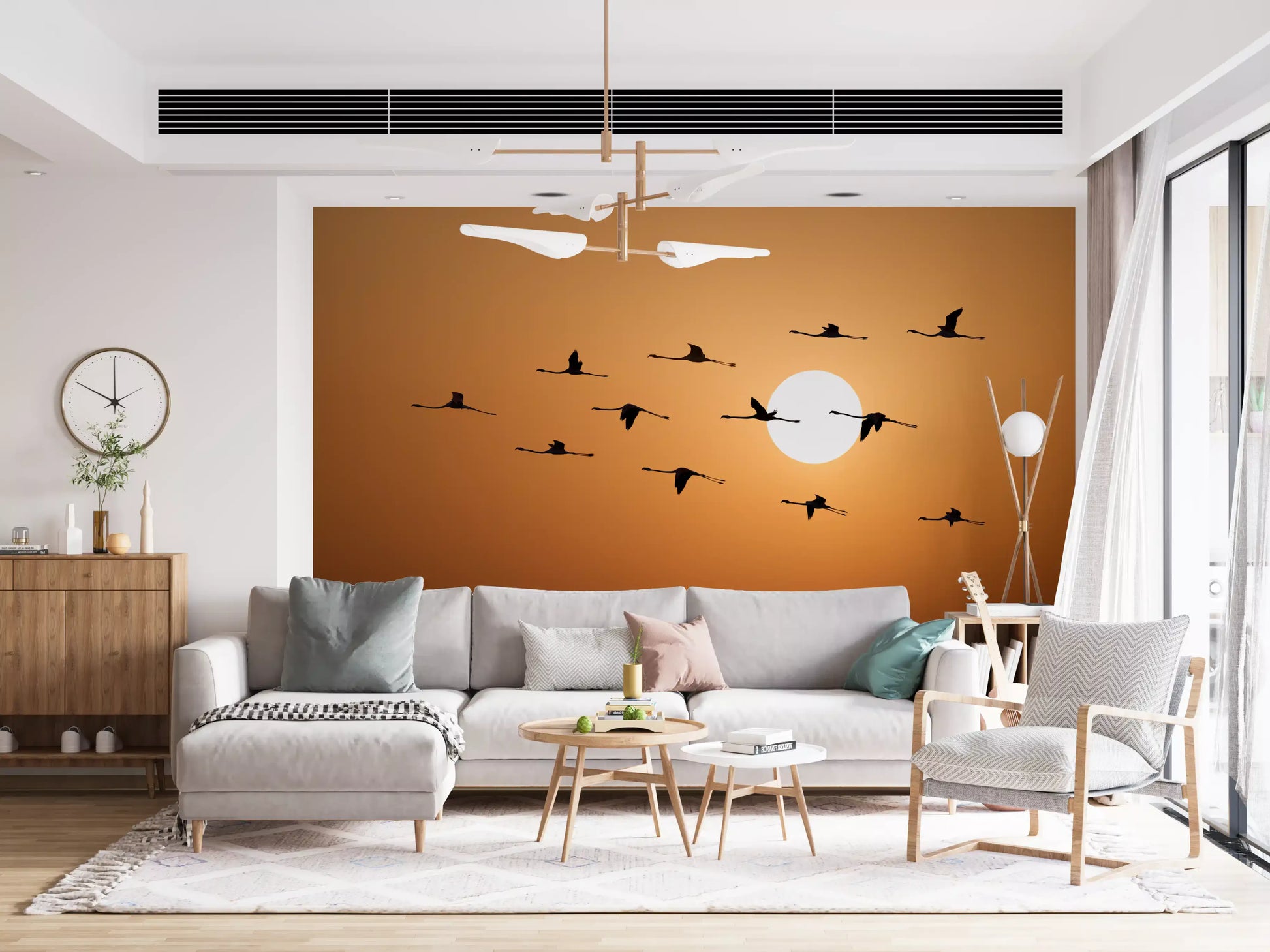 Sunset inspired wall mural with flock of birds and warm hues