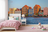 Harbour city wall mural with colourful buildings and calm waters