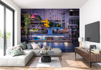 Waterfront skyline wall mural with warm lights and reflections
