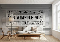 Stone plaque wall mural with intricate scrollwork and mouldings