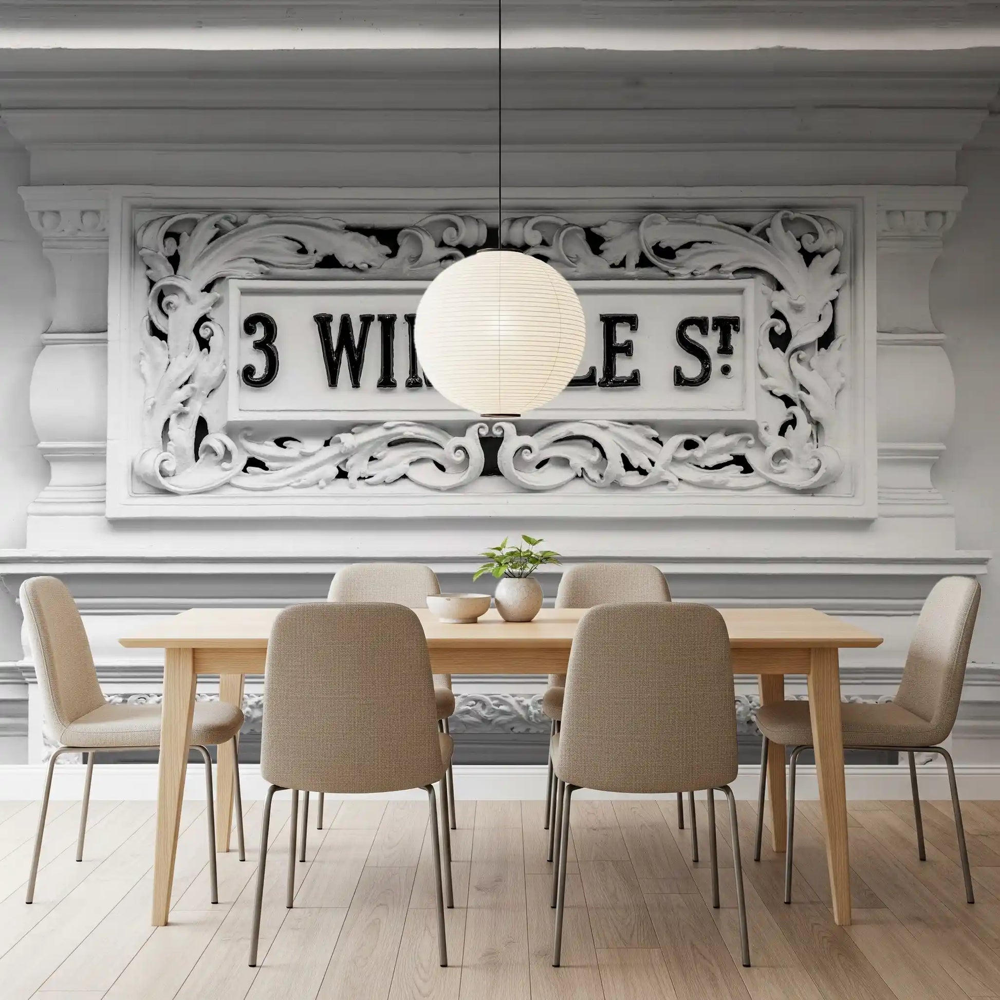 Architectural wall mural featuring monochrome carved stone design