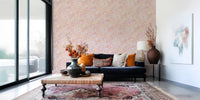 Soft floral wallpaper with peach swirls, pale petals, and airy pattern rhythm