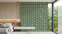 Ivory drops sprinkle sage green tones over the bedroom Mid Century Seed Dots wall mural.