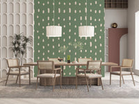 Cream and sage green build the Mid Century Seed Dots wall mural in a dining room.