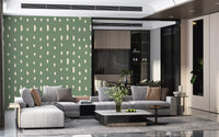 Loose ivory drops freckle the sage green field of this Mid Century Seed Dots wall mural.