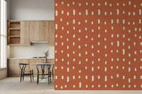 A dining room takes on creamy tones via the Mid Century Seed Dots wall mural.