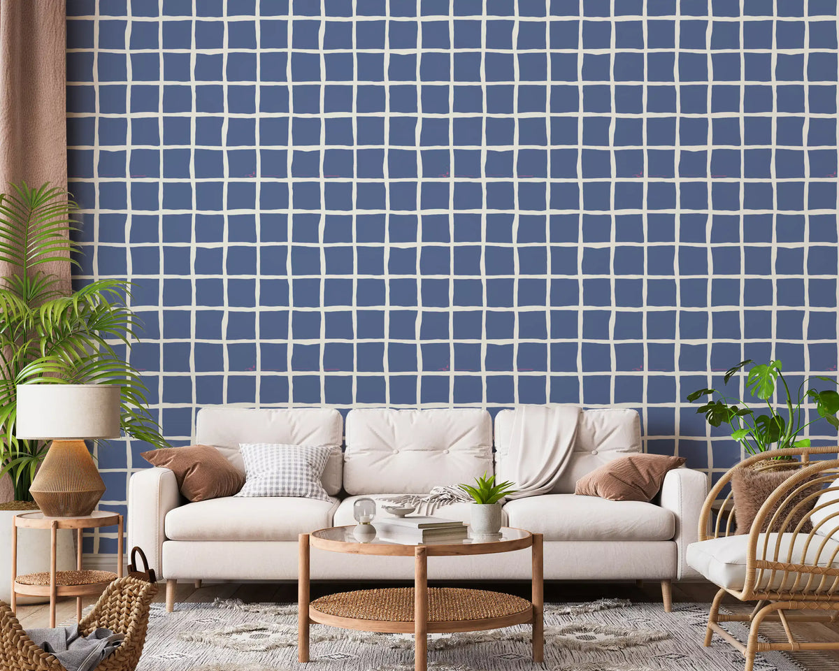 Dusty blue squares sit behind a calm living room in this wavy grid wallpaper.