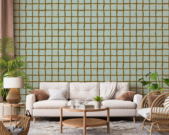 Mid Century Wavy Grid Soft Sage wallpaper warms a relaxed living room.