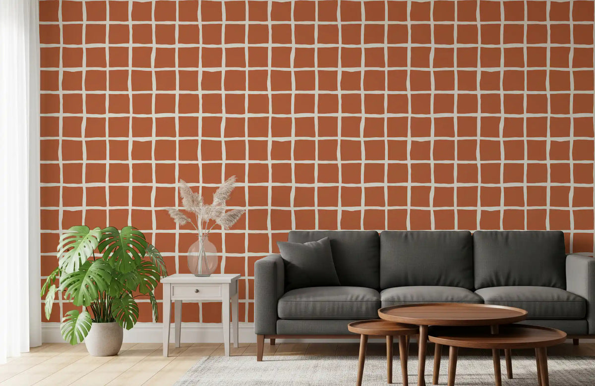 Slanted cream lines mark a rust-toned living room wallpaper with mid-century flair.