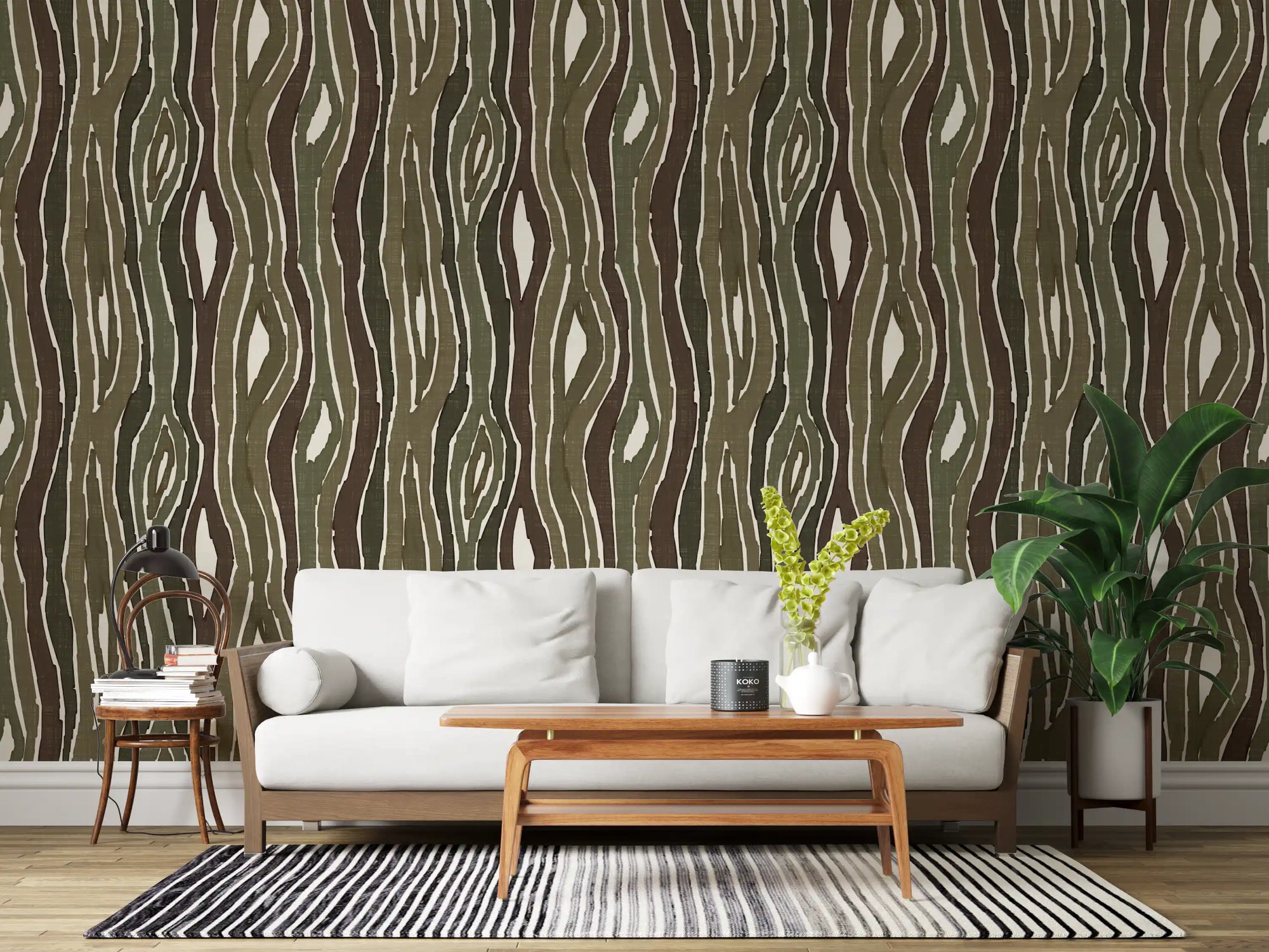 Vertical bark stripes flow through a quiet living room with this earthy moss wallpaper.