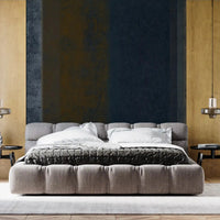 In a bedroom, textured earth stripes rise floor to ceiling in the wall mural GD10817