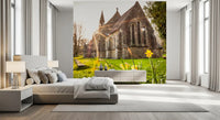Sunlit Country Church with Spring Daffodils Wall Mural