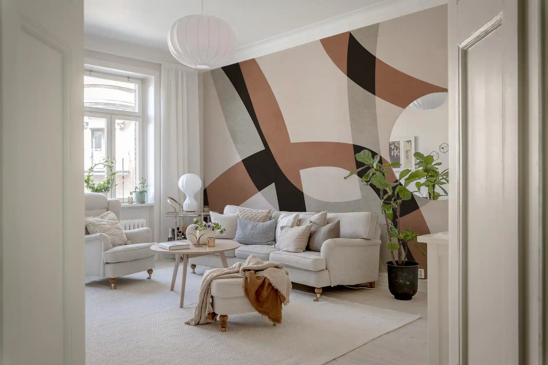 Clay arcs curving over charcoal on a minimalist wall mural in a living room GD11305