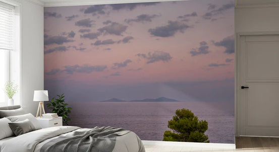 Bedroom set with an ethereal island dusk wall mural, pastel ocean scene GD11468