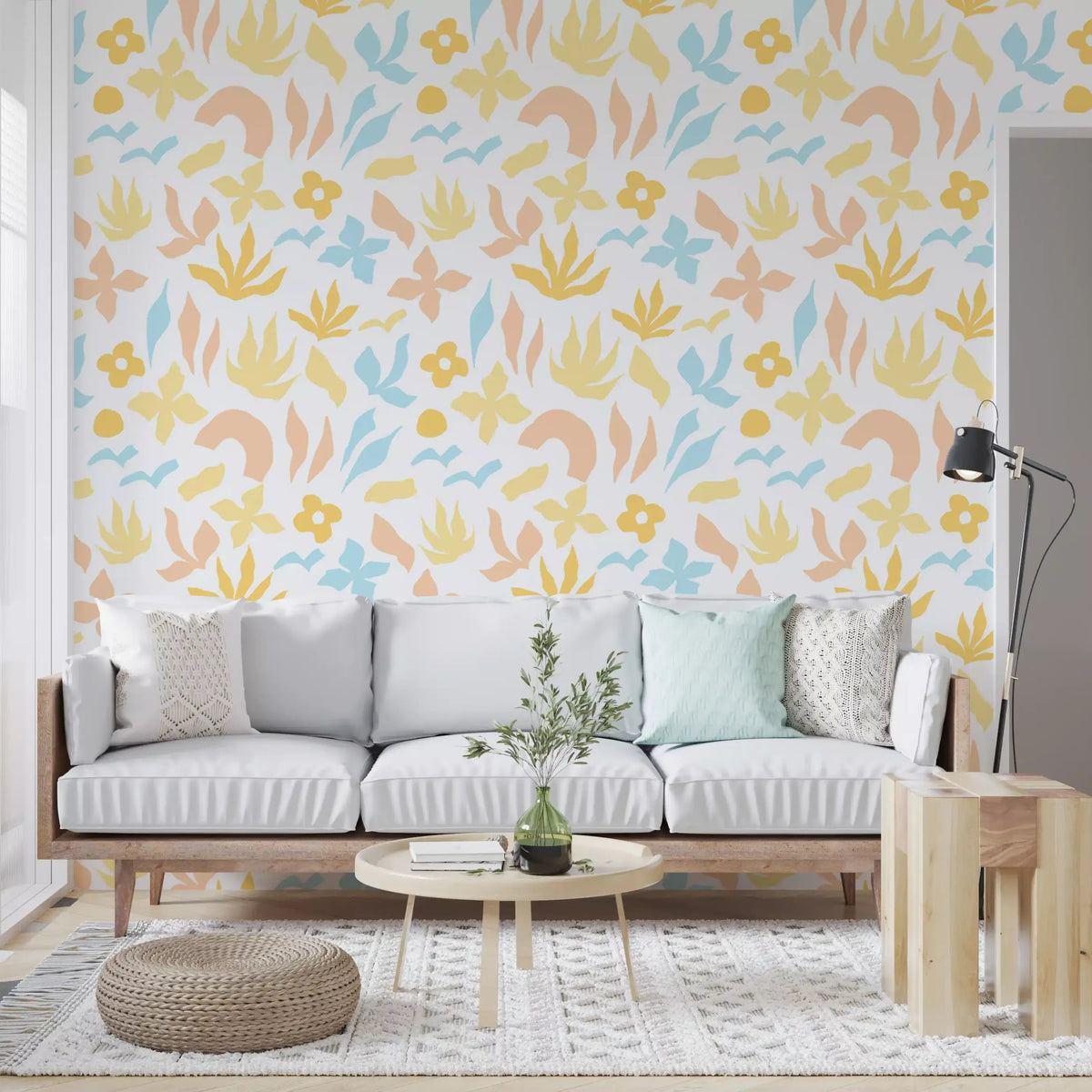 Wallpaper in a living room holds pastel leaves and flowers on white GD11600