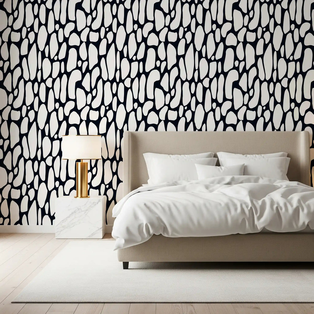Brushed black marks fill a bedroom in the Organic Monochrome Pebbles wallpaper. GD12223