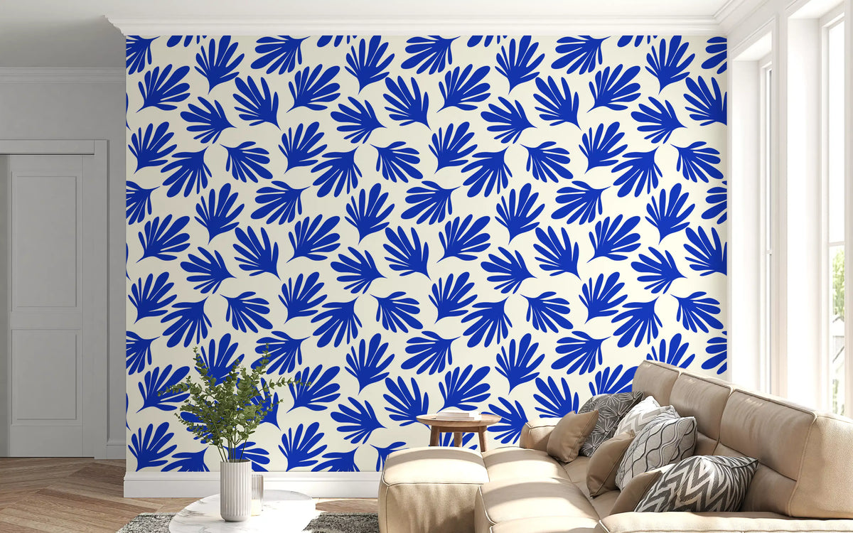 Cut-out leaf shapes fill a living room in the Cobalt Leaf Silhouette wallpaper. GD12225