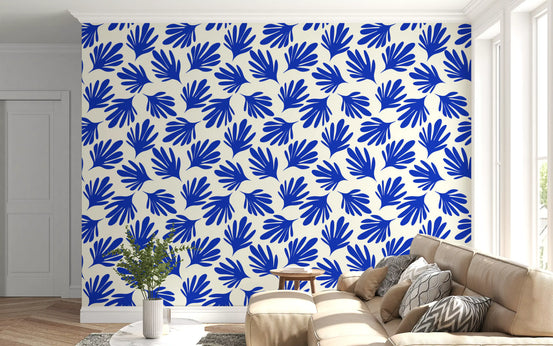 Cut-out leaf shapes fill a living room in the Cobalt Leaf Silhouette wallpaper. GD12225