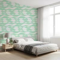 Sage lines ripple through a bedroom area in the wallpaper GD12233