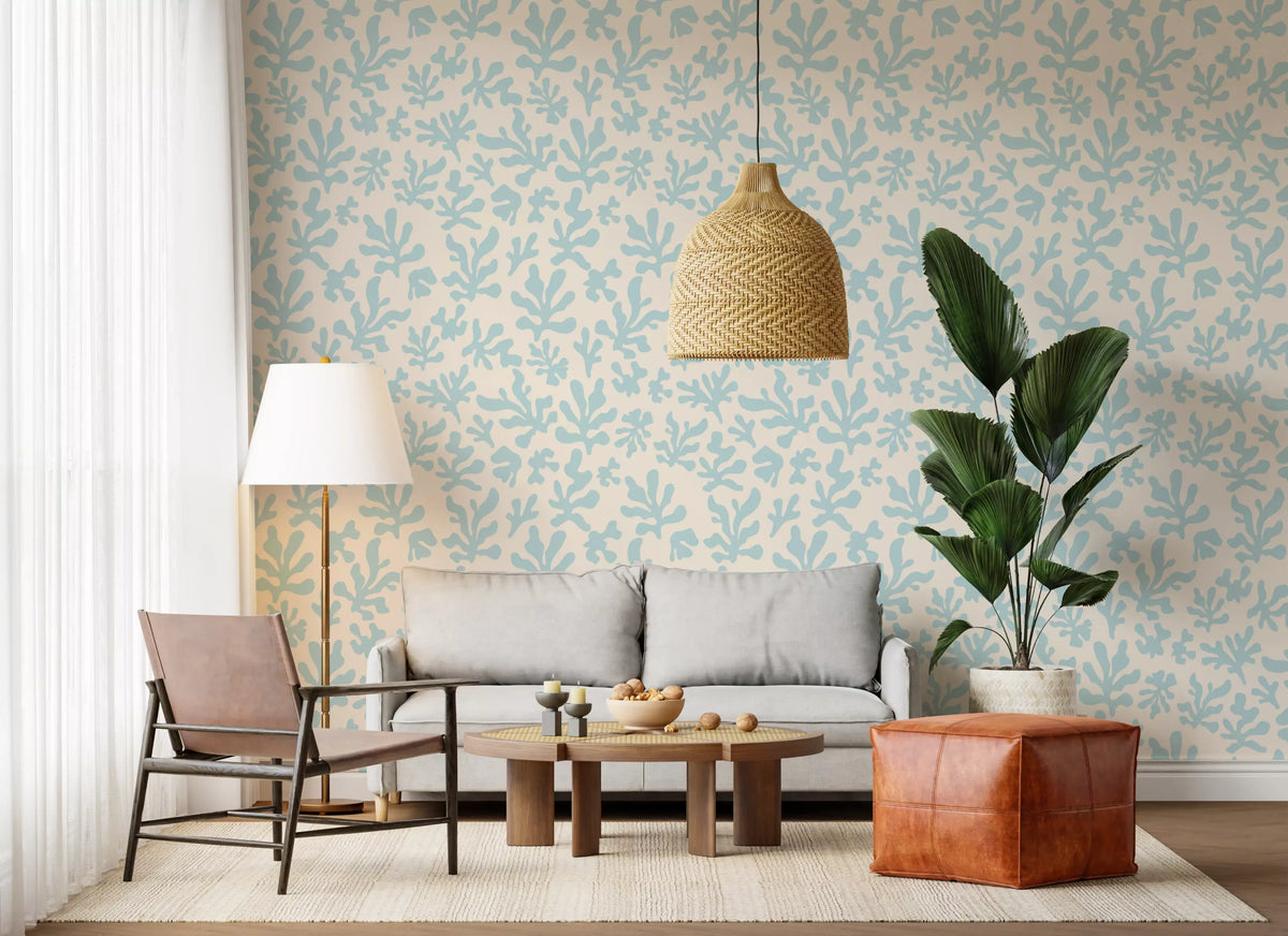 Seaweed silhouettes scatter behind a living room on this Nordic wallpaper GD12235
