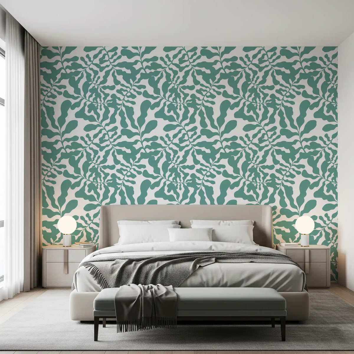 Sage botanical leaf trail wallpaper on a bedroom accent wall behind a grey bed with grey bedding GD12272