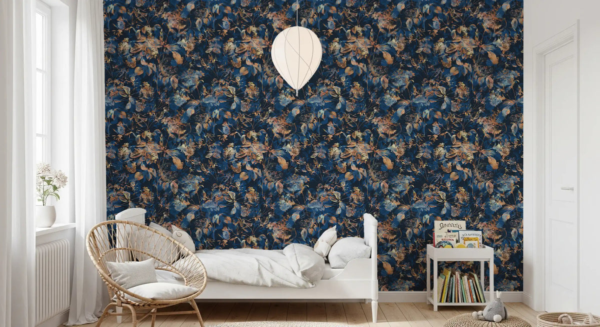 Navy botanical wallpaper by a bed with a rattan hanging chair and book cart GD12284