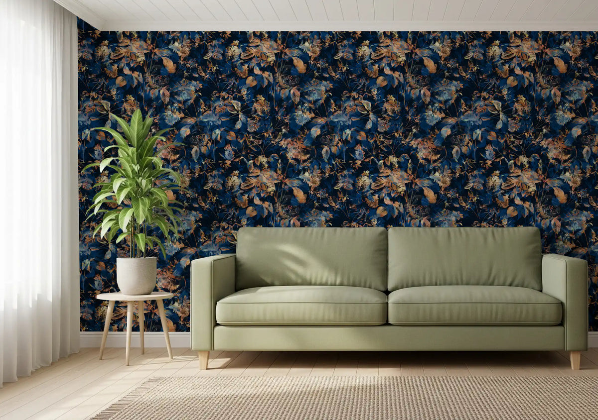 Navy botanical wallpaper behind a sage green leather sofa and leafy plant GD12284