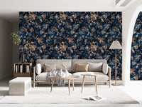 Navy botanical wallpaper in a living room with a cream sofa and floor lamp GD12284
