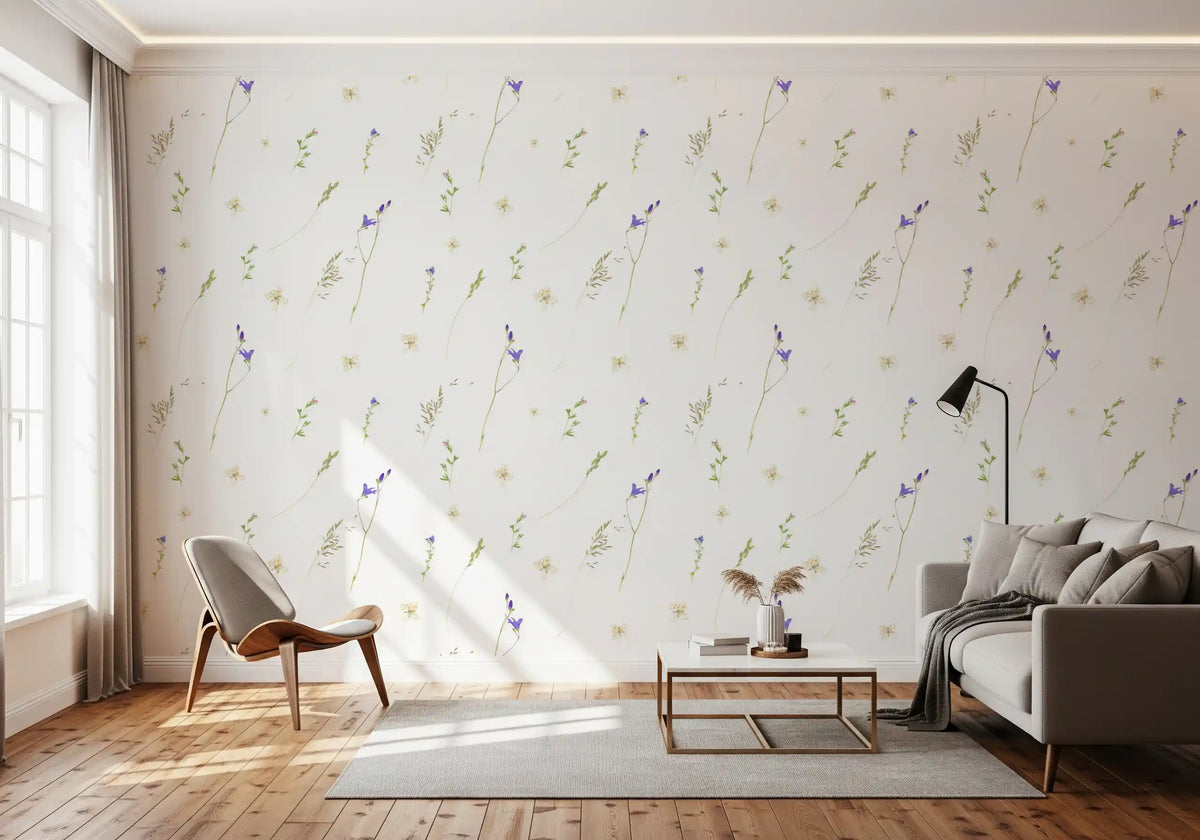 Pressed grasses wallpaper behind a grey sofa and tan lounge chair on a wood floor GD12291