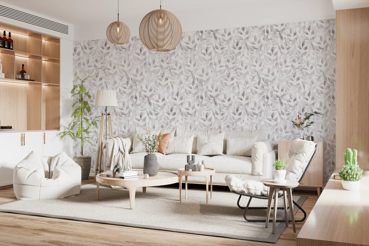 Muted grey botanical foliage wallpaper in a living room with a cream sofa and wood shelving GD12337