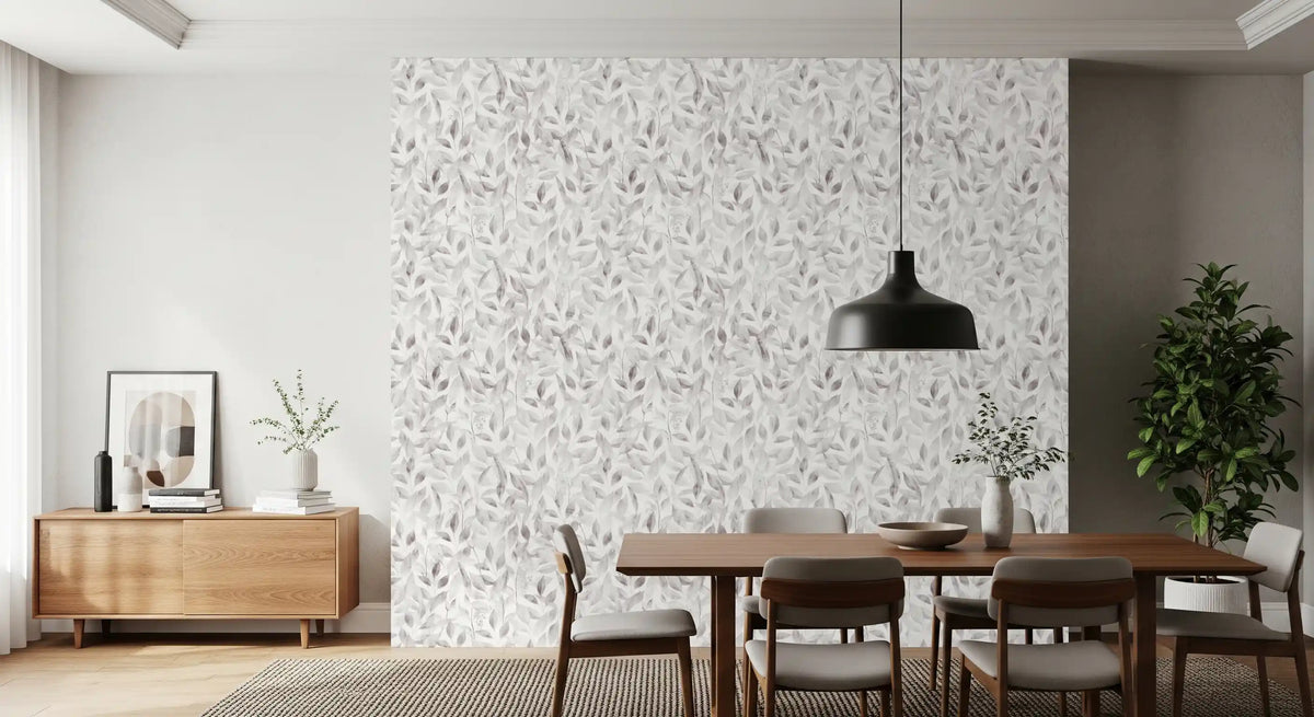 Muted grey botanical foliage wallpaper in a dining room with a wood table and black pendant GD12337