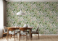 Sage floral meadow wallpaper in a dining nook with a wood table and white pendant GD12339