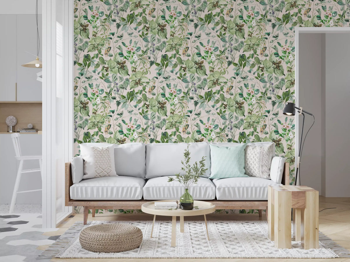 Soft sage floral meadow wallpaper in a living room with a grey sofa beside the kitchen GD12339