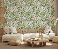 Sage floral wallpaper in a living room with a cream sofa and round wood coffee table GD12339