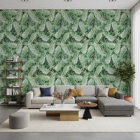 Tropical pineapple wallpaper in a living room with a grey sectional and open bookshelf GD12340