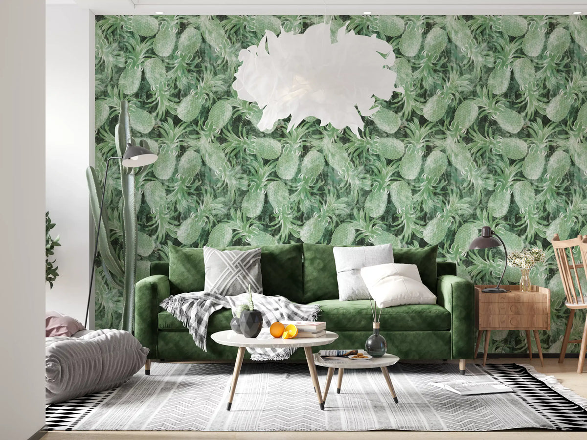 Green tropical pineapple wallpaper behind a velvet sofa with a white feather pendant light GD12340