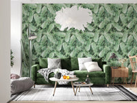 Green tropical pineapple wallpaper behind a velvet sofa with a white feather pendant light GD12340