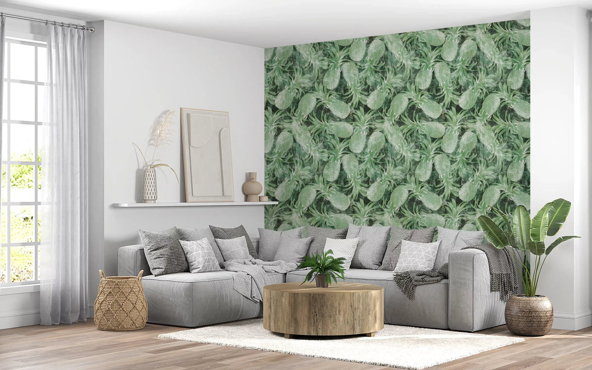 Pineapple leaf wallpaper in a living room with a grey sectional and gold drum side table GD12340