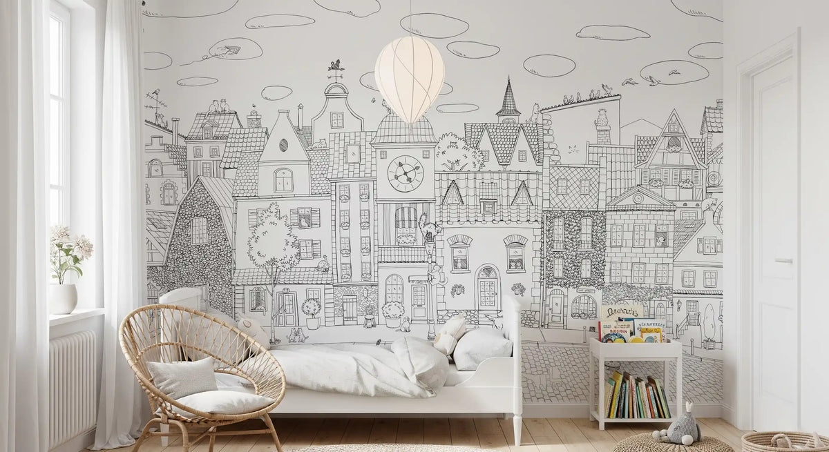 Cat cityscape wall mural with a hot air balloon behind a rattan peacock chair and white bed GD12396