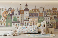 Village townscape wall mural behind a bed with rocket bedding and plush bunnies GD12398