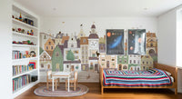 Cat and dog village mural in a room with full bookshelves and a striped knit blanket GD12398