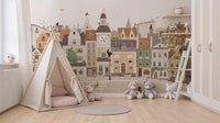 Pastel village townscape wall mural framing a teepee tent and plush teddy bears GD12398